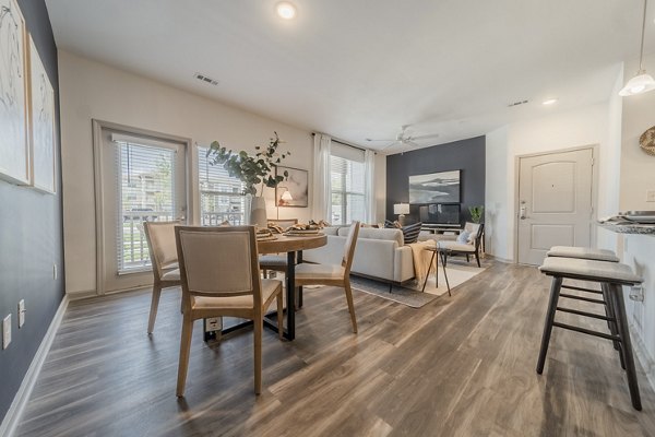 Dining area featuring modern furnishings and open layout at Pringle Square Apartments