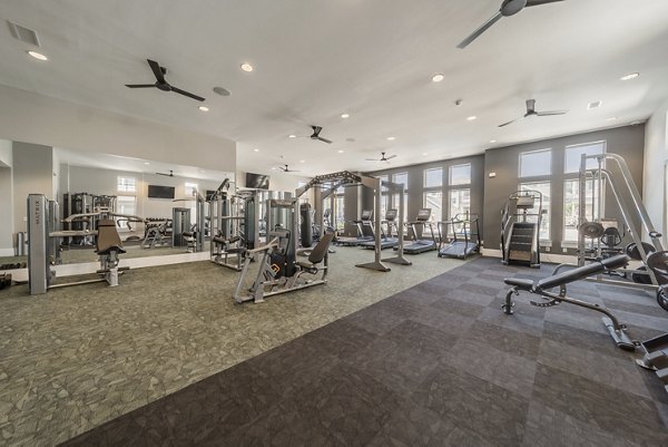State-of-the-art fitness center featuring modern equipment at Pringle Square Apartments