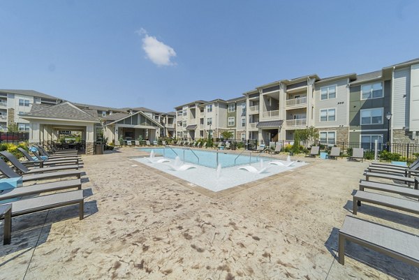 Sparkling pool at Pringle Square Apartments offering luxury relaxation