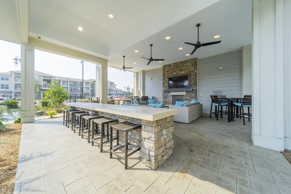 Stylish patio with modern seating at Pringle Square Apartments