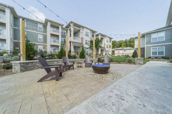 Cozy fire pit area at Pringle Square Apartments, offering relaxed outdoor seating and ambience for residents in this luxury community
