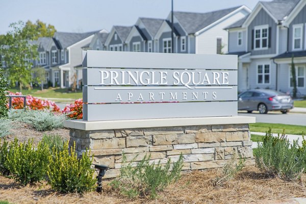 Pringle Square Apartments sign in a scenic residential area