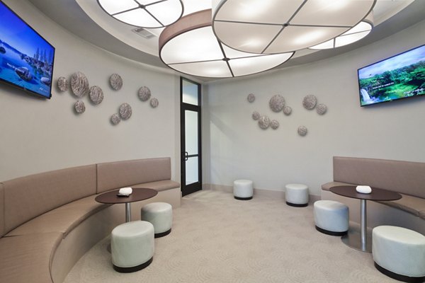 Elegant clubhouse featuring modern seating and ambient lighting at Echo Apartments