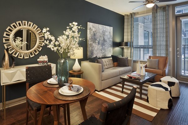 Dining area with modern furnishings and pendant lighting at Echo Apartments