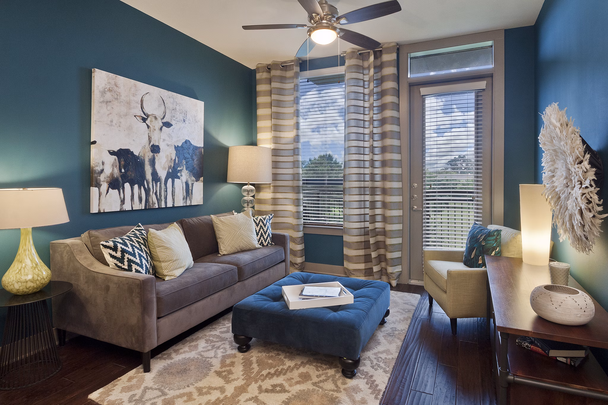 Cozy living room with modern decor at Echo Apartments featuring plush seating and natural light