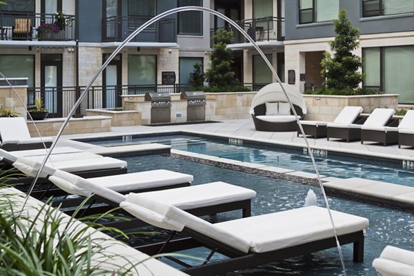 Luxurious poolside lounging area at Echo Apartments