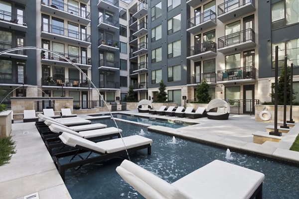 Rooftop pool with sun loungers offering city views at Echo Apartments, a luxury Greystar property