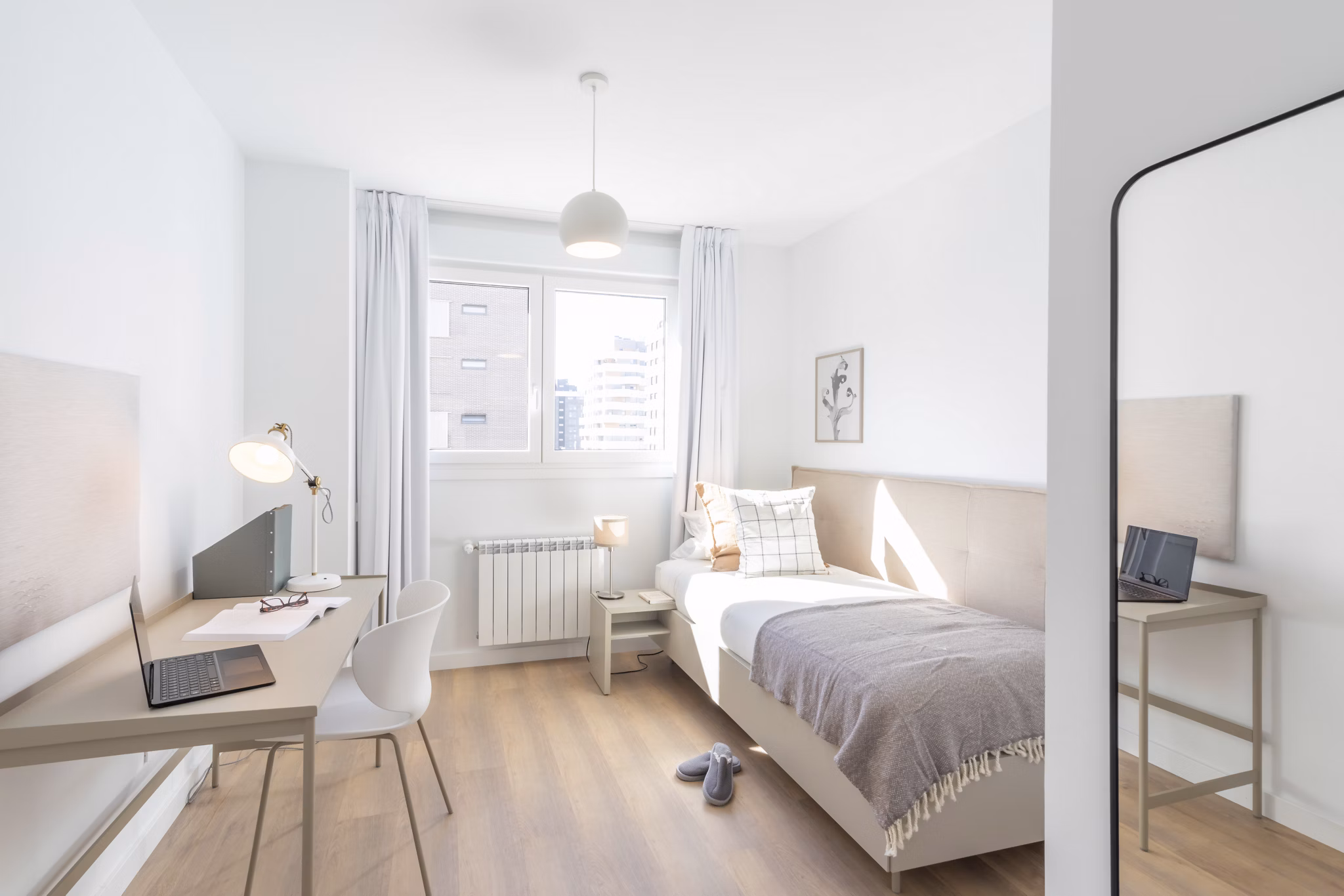 Bright and inviting bedroom with a stylish design and large windows at Be Casa Essential Canaveral.