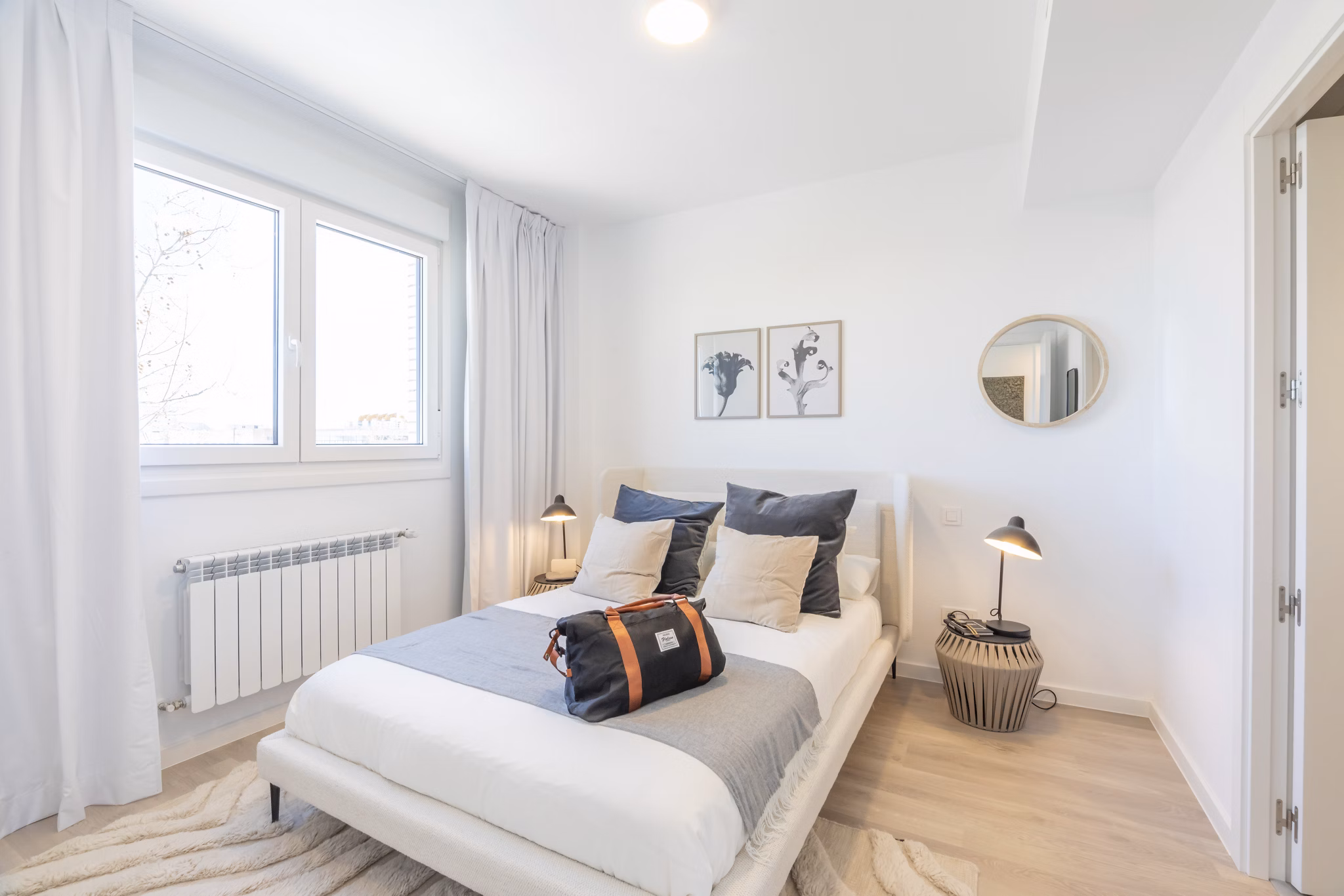 Bright and airy bedroom with stylish furnishings at Be Casa Essential Barajas.
