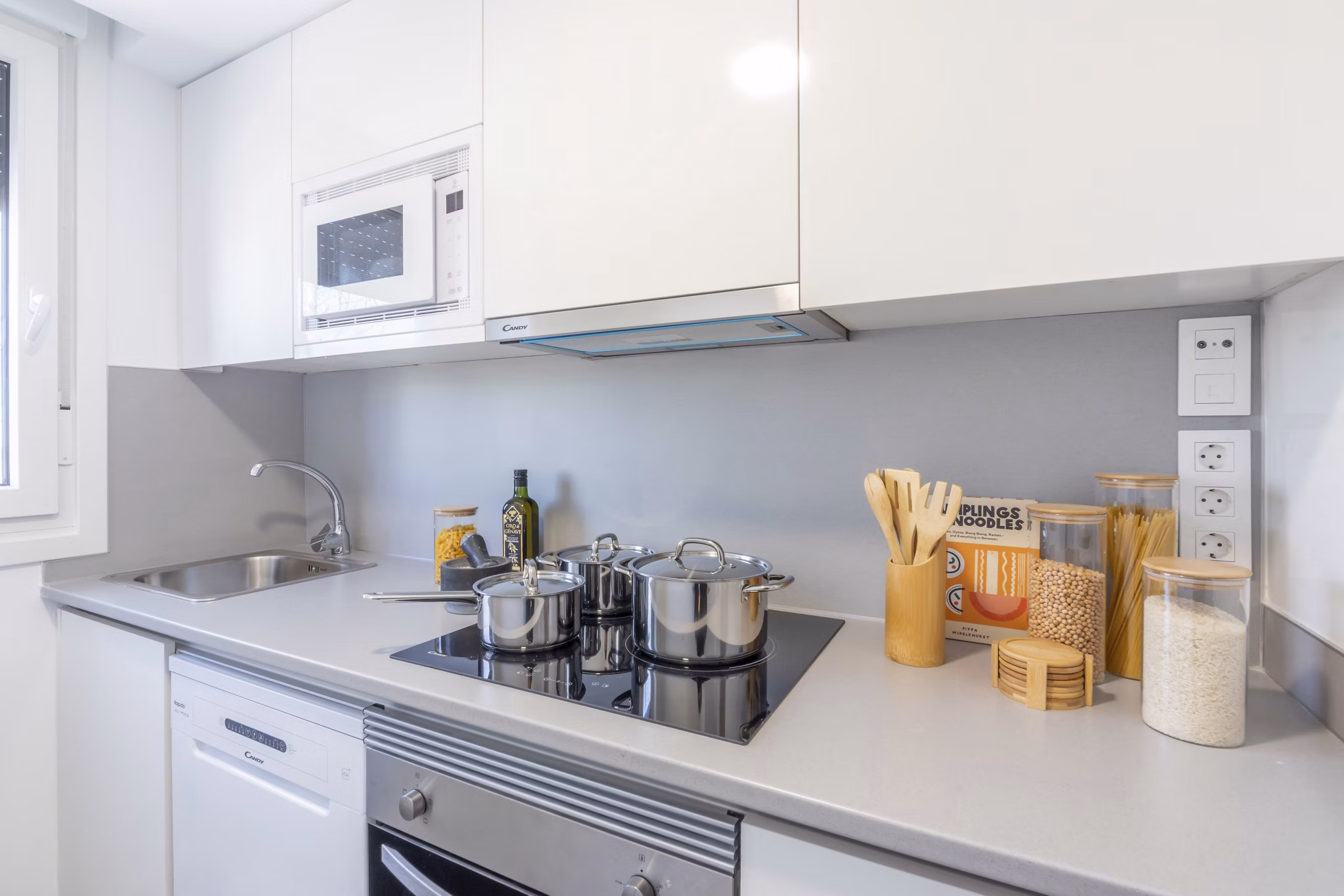 Modern kitchen with sleek appliances and functional design at Be Casa Essential Barajas.