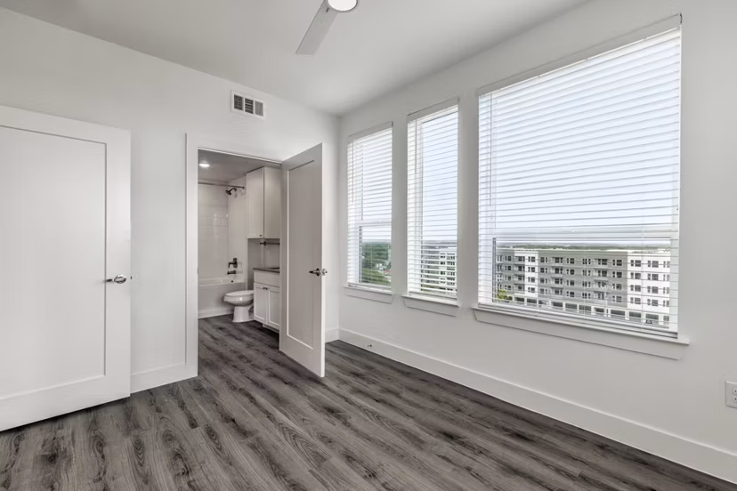 Spacious bedroom with elegant decor in Crosstown Apartments, luxurious living at its finest