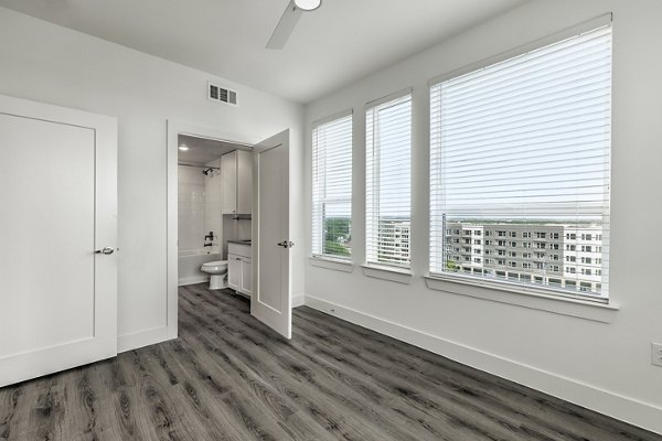 Spacious bedroom with elegant decor in Crosstown Apartments, luxurious living at its finest