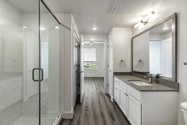 Bathroom featuring modern fixtures at Crosstown Apartments, a Greystar community
