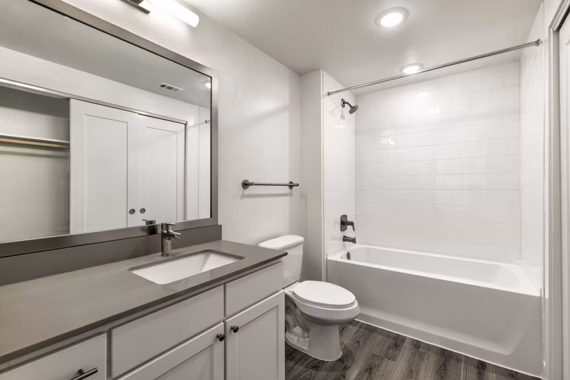 Elegant bathroom with marble countertops and modern fixtures at Crosstown Apartments