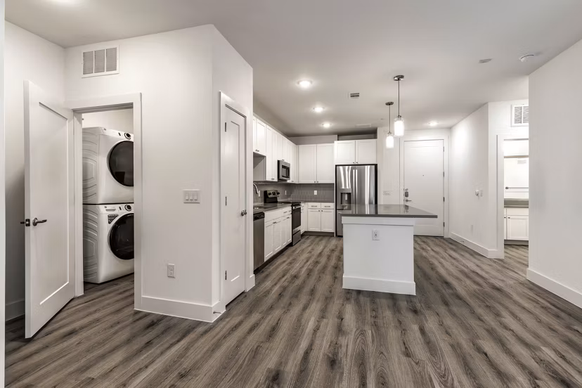 Modern kitchen with stainless steel appliances at Crosstown Apartments, offering premium living spaces in urban settings