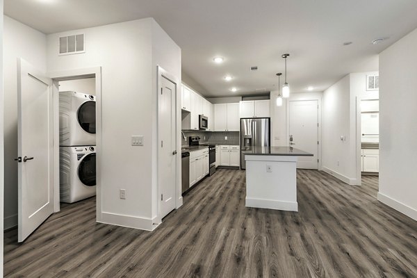 Modern kitchen with stainless steel appliances at Crosstown Apartments, offering premium living spaces in urban settings