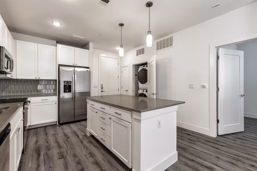 Modern kitchen with sleek cabinetry and stainless steel appliances in Crosstown Apartments