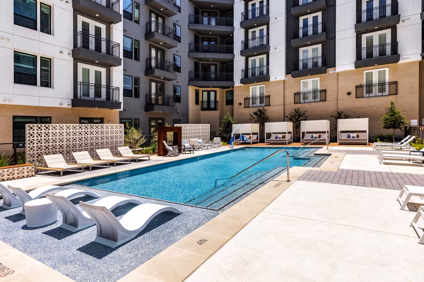 Rooftop infinity pool at Crosstown Apartments with panoramic skyline views