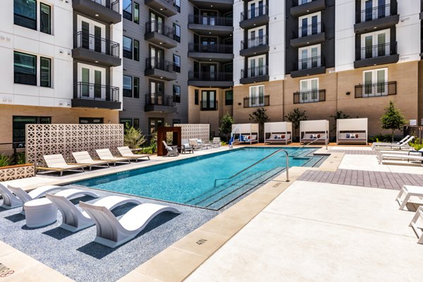 Rooftop infinity pool at Crosstown Apartments with panoramic skyline views