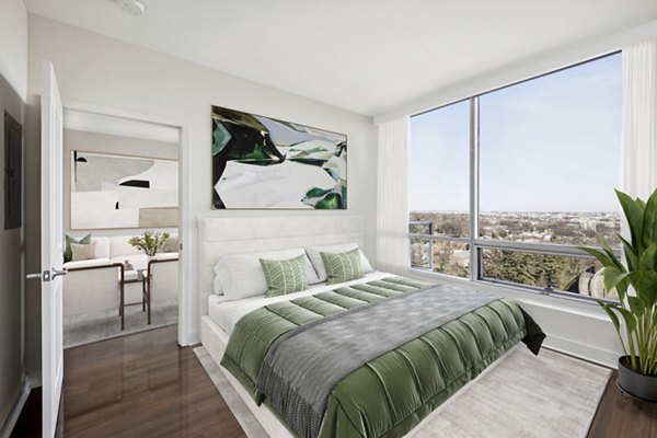 Cozy bedroom with contemporary design and large windows at Verde Pointe