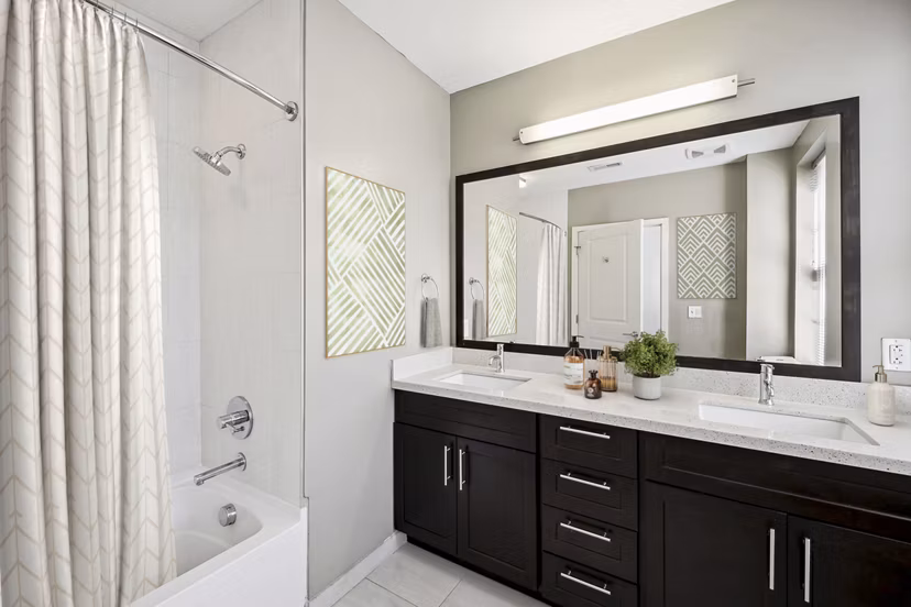 Elegant bathroom featuring marble countertops and modern fixtures at Verde Pointe apartments