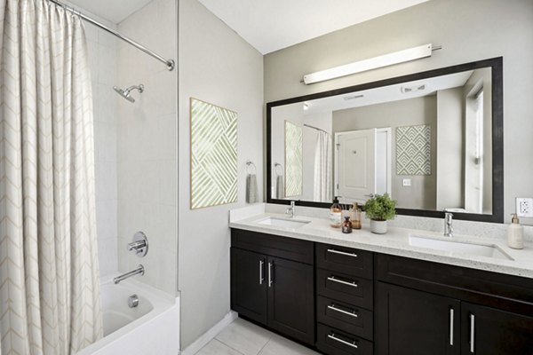 Elegant bathroom featuring marble countertops and modern fixtures at Verde Pointe apartments