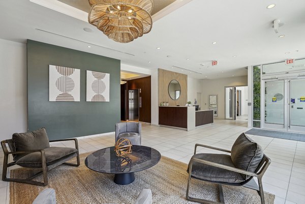 Clubhouse featuring modern design and cozy seating at Verde Pointe luxury apartments, ideal for socializing and relaxation