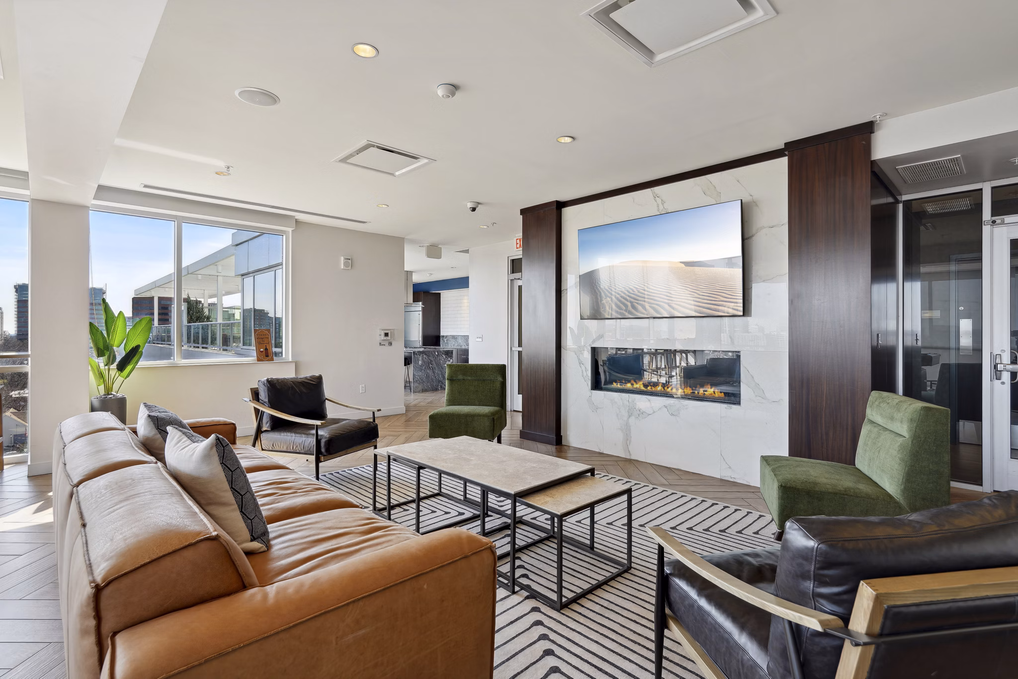 Clubhouse at Verde Pointe: Modern clubhouse with stylish decor and ample seating, perfect for resident gatherings at luxury apartments