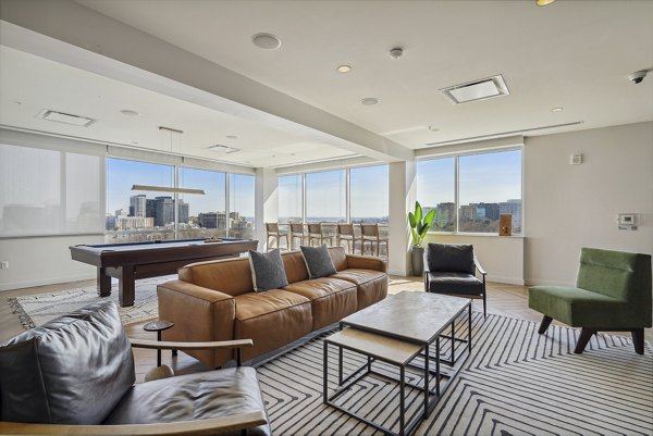 Modern clubhouse with lounge seating at Verde Pointe apartments in Arlington, offering luxury amenities for relaxation and social gatherings