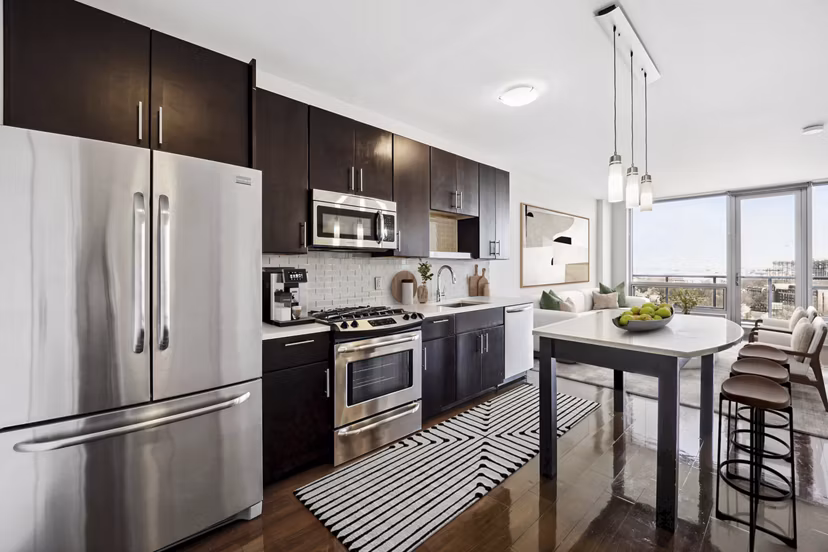 Modern kitchen with stainless steel appliances at Verde Pointe apartments