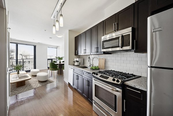 Modern kitchen with stainless steel appliances at Verde Pointe luxury apartments
