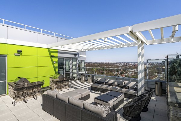 Scenic outdoor courtyard at Verde Pointe luxury apartments with seating areas and lush greenery