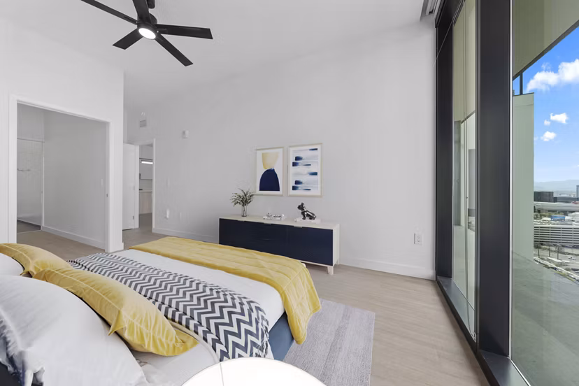 Cozy bedroom featuring modern decor at Skye on 6th Apartments
