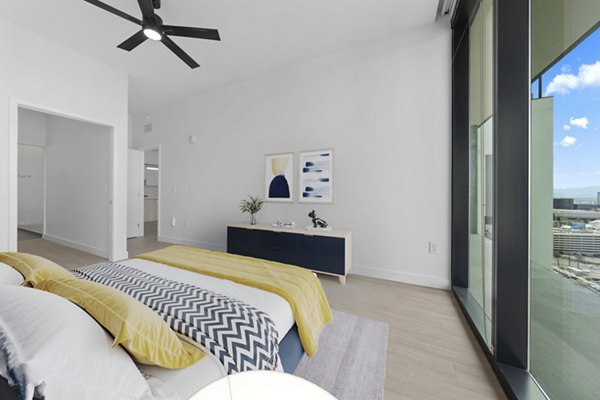 Cozy bedroom featuring modern decor at Skye on 6th Apartments