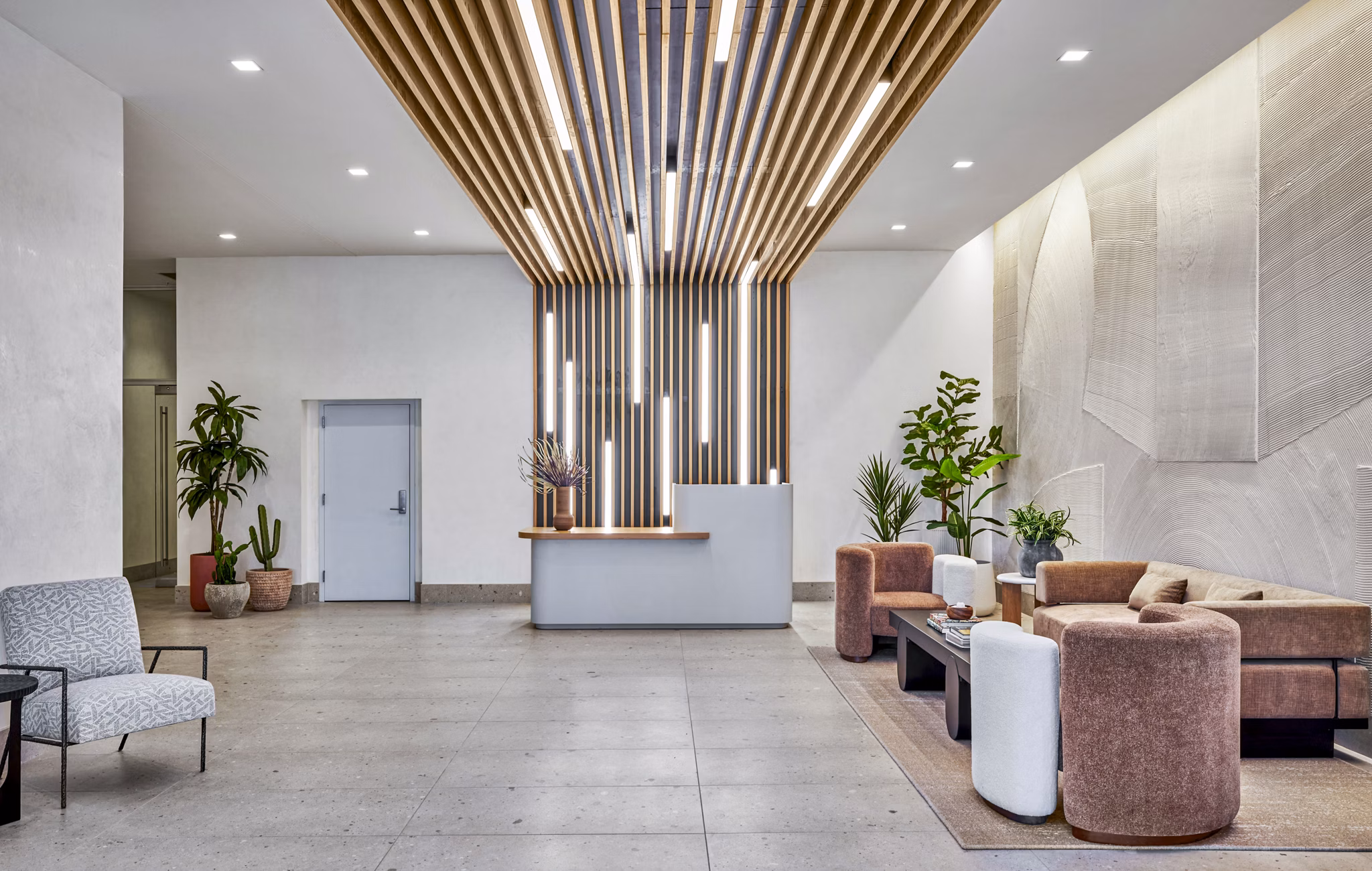 Stylish clubhouse and lobby at Skye on 6th Apartments with modern seating and decor, offering a luxurious welcome to residents and guests