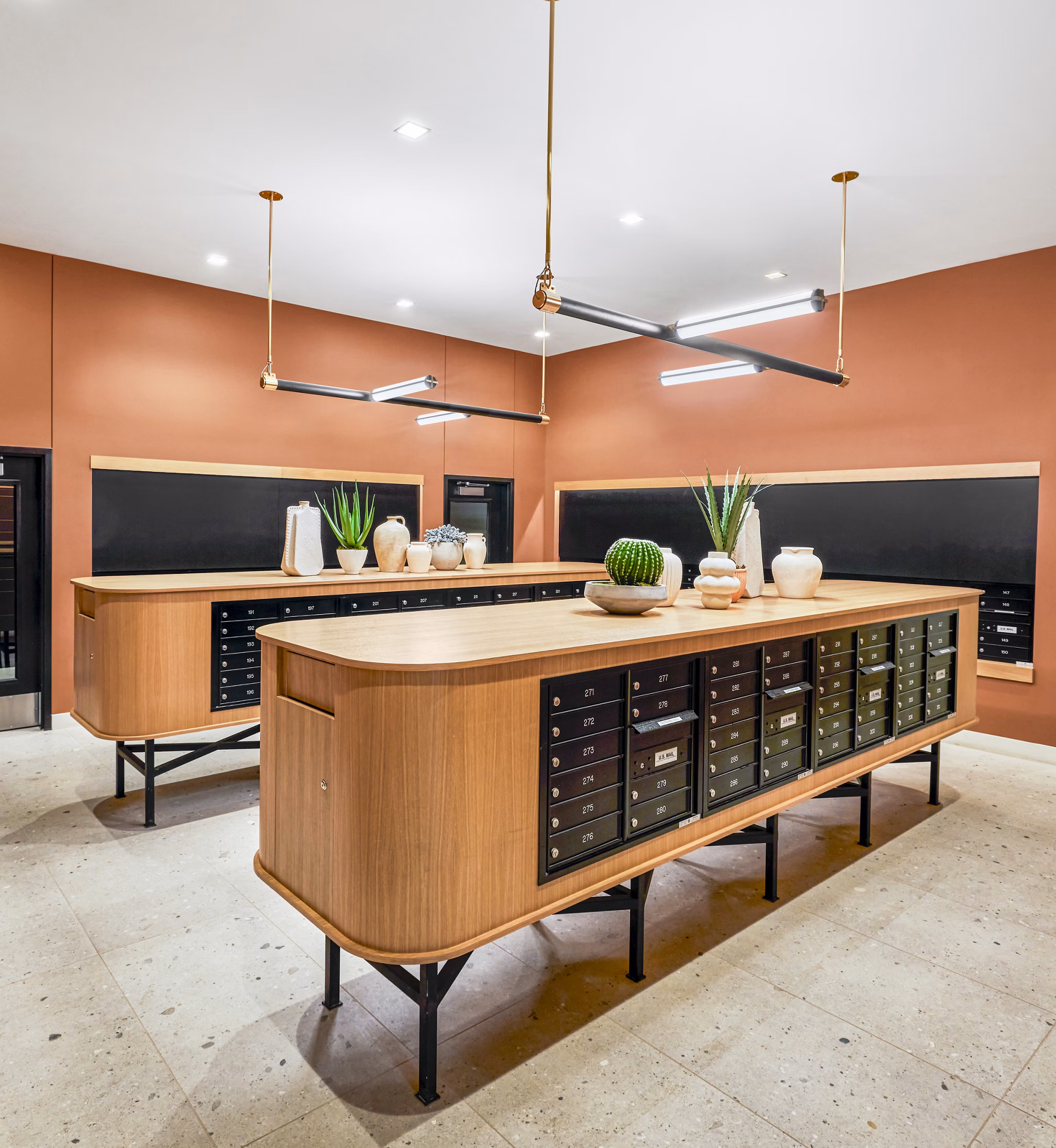 Mail room with modern design and lockers at Skye on 6th Apartments