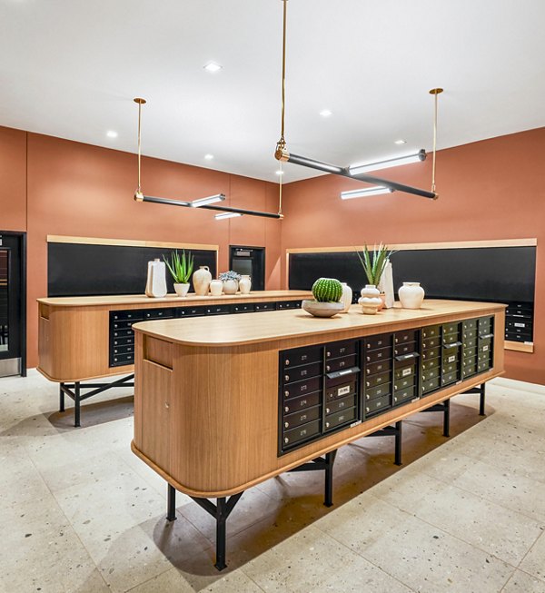 Mail room with modern design and lockers at Skye on 6th Apartments