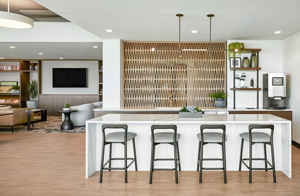 Skye on 6th Apartments: Modern clubhouse with lounge seating and workspaces in Tempe, offering luxury living amenities