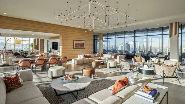 Modern clubhouse with lounge seating and pool table at Skye on 6th Apartments