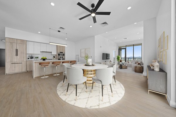 Dining area featuring modern decor and seating at Skye on 6th Apartments