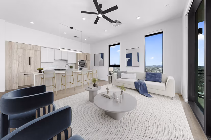 Spacious living room with modern decor and city views in Skye on 6th Apartments, luxury living in the heart of the city