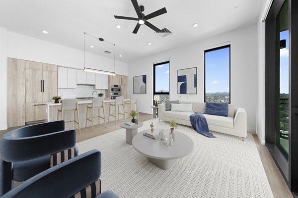 Spacious living room with modern decor and city views in Skye on 6th Apartments, luxury living in the heart of the city