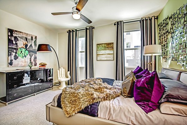Elegant bedroom with modern furnishings at Constellation Apartments, offering comfort and style in a luxury living environment