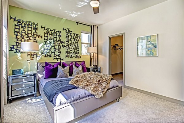 Cozy bedroom with modern decor at Constellation Apartments, Greystar luxury residence