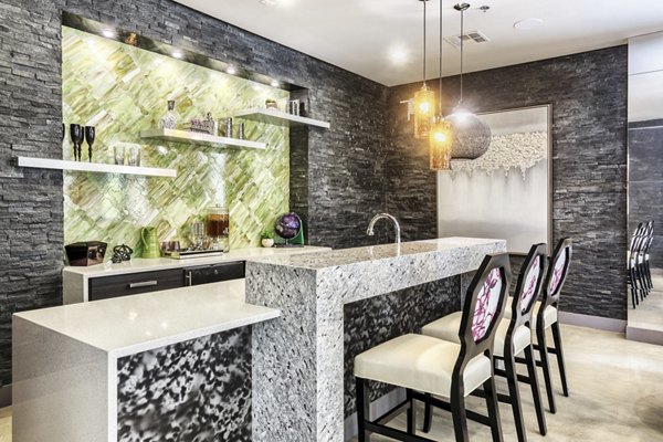 Clubhouse featuring modern interiors and communal seating at Constellation Apartments