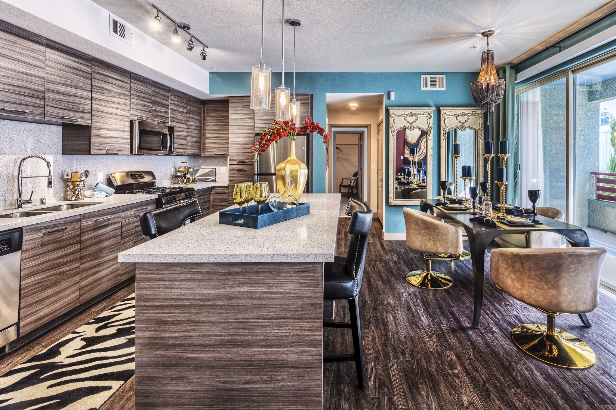 Modern kitchen with sleek countertops and stainless steel appliances in Constellation Apartments