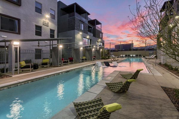 Relax by the luxurious pool at Constellation Apartments, offering serene outdoor space and modern design for ultimate leisure
