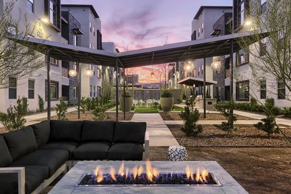 Inviting outdoor fire pit area at Constellation Apartments, ideal for relaxation and social gatherings under the stars