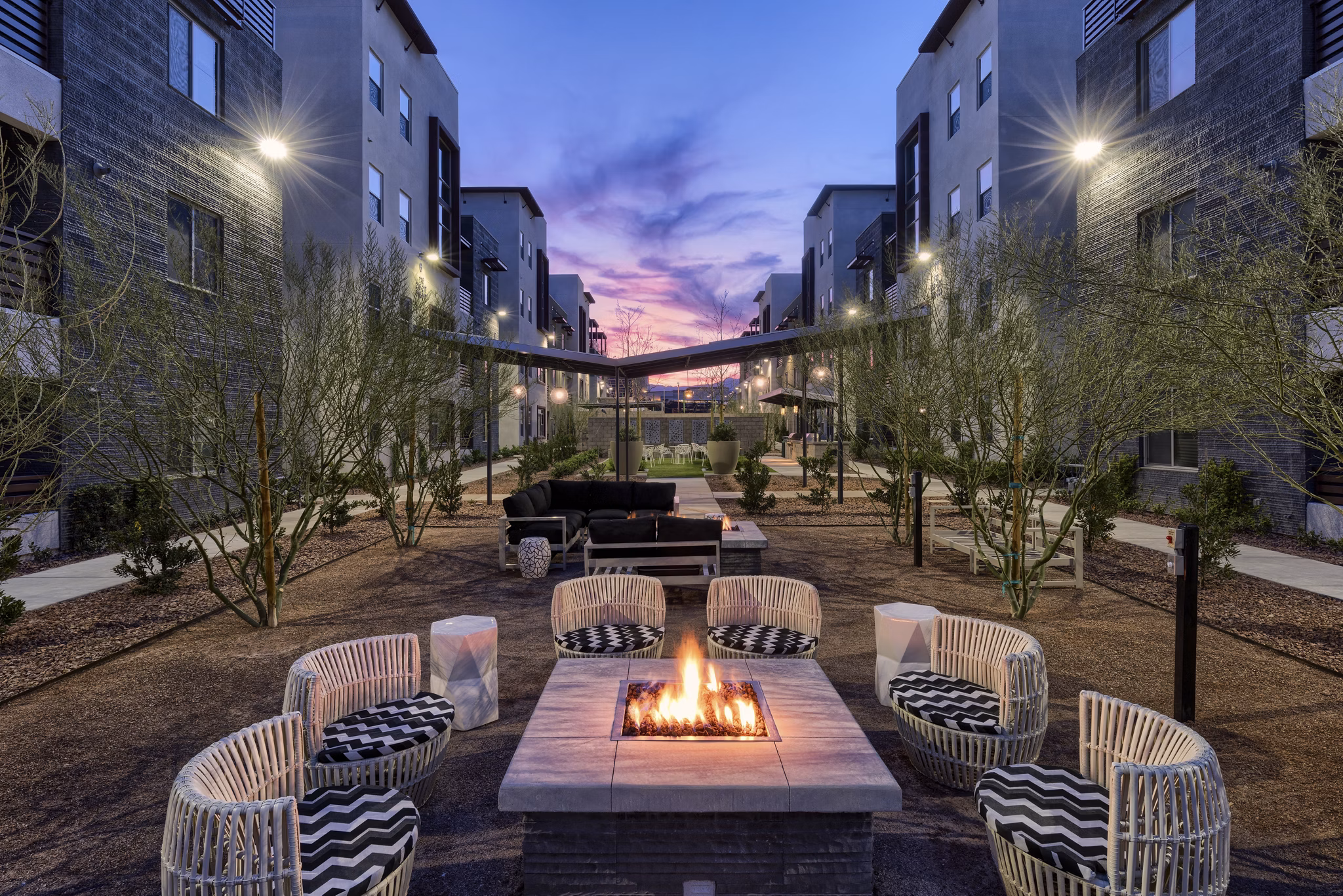 Fire pit with cozy seating area at Constellation Apartments, a Greystar luxury property