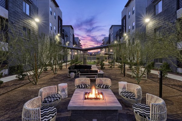 Fire pit with cozy seating area at Constellation Apartments, a Greystar luxury property